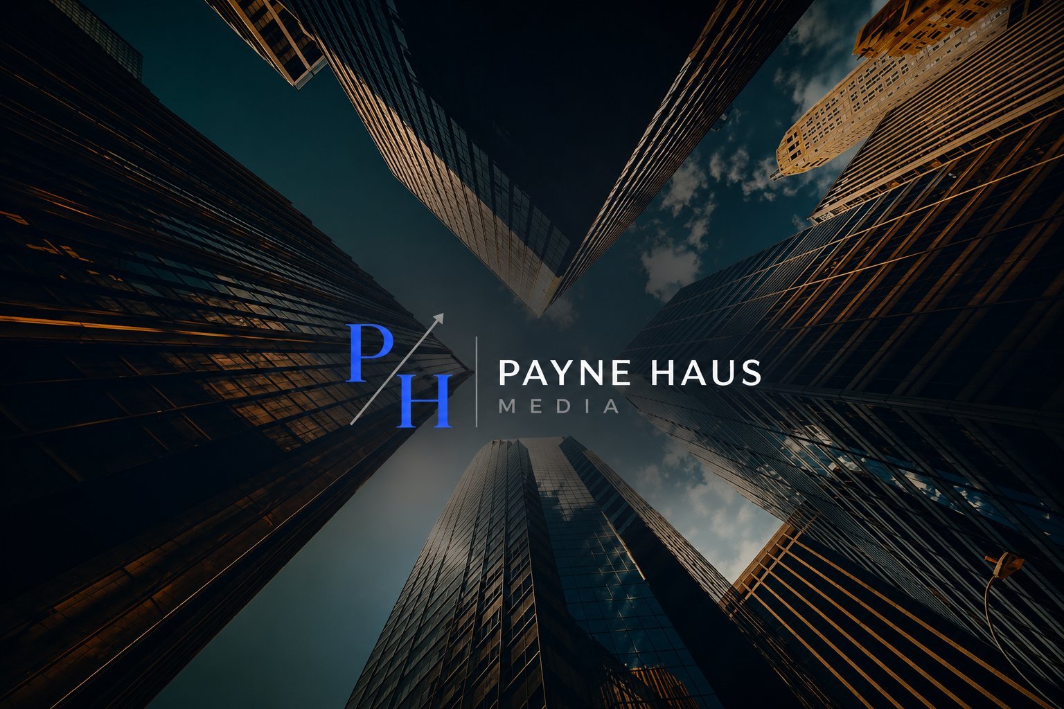 Payne Haus Media — looking up at a city skyline with the Payne Haus Media logo